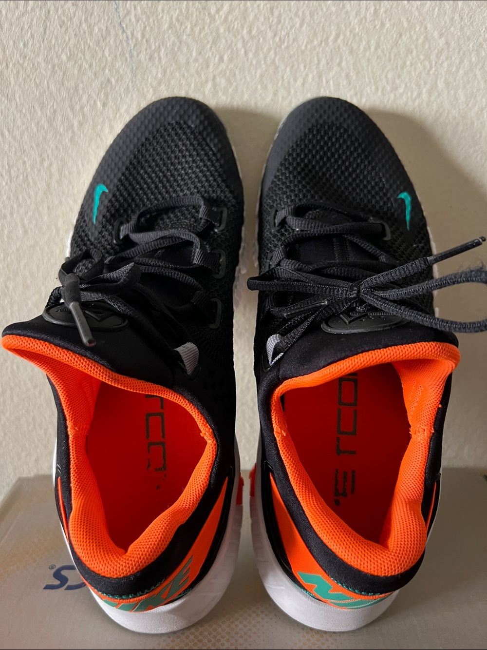 Nike Black Sneakers with Orange Interior and Teal Accents